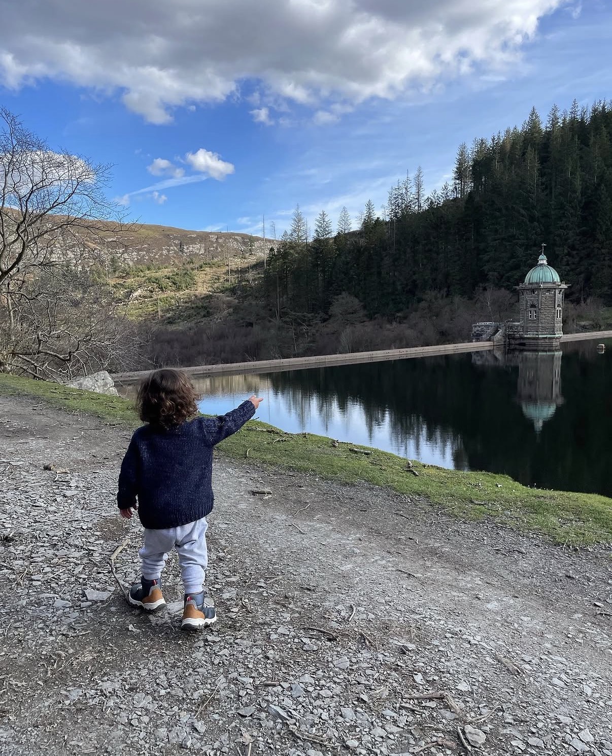 The Elan Valley reservoir, its dam and stone valve tower seen across the water
